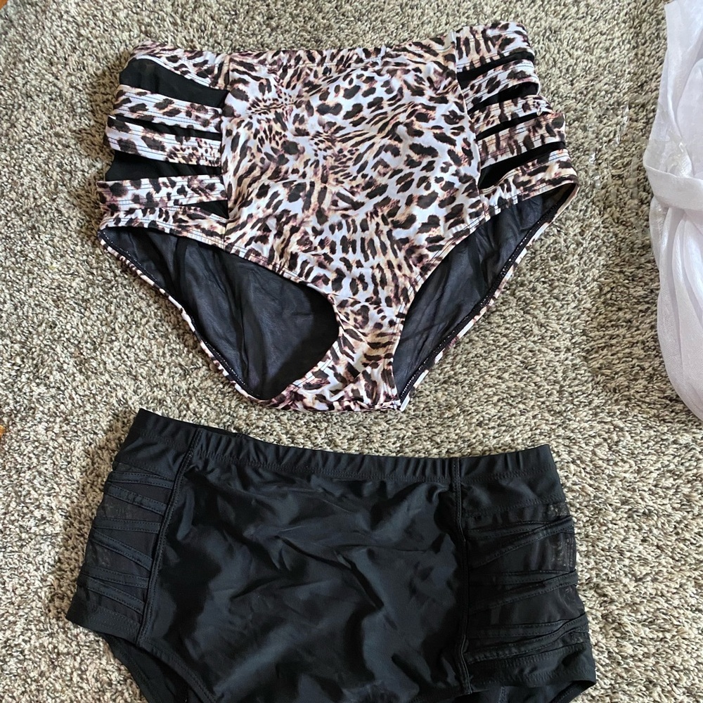 Torrid Swimsuits. 3 barely used. Two tops & two bottoms to mix and match. 0 & 00